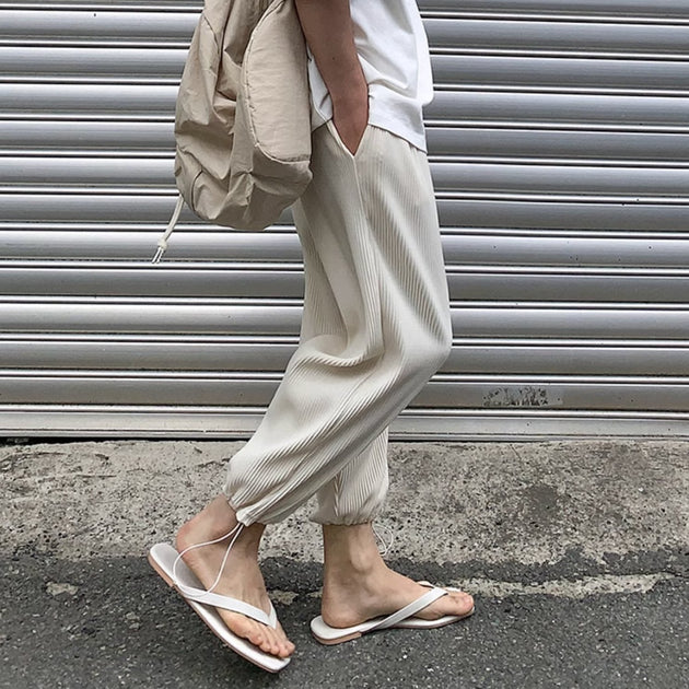 PLEATED ANKLE PANTS - Aumori