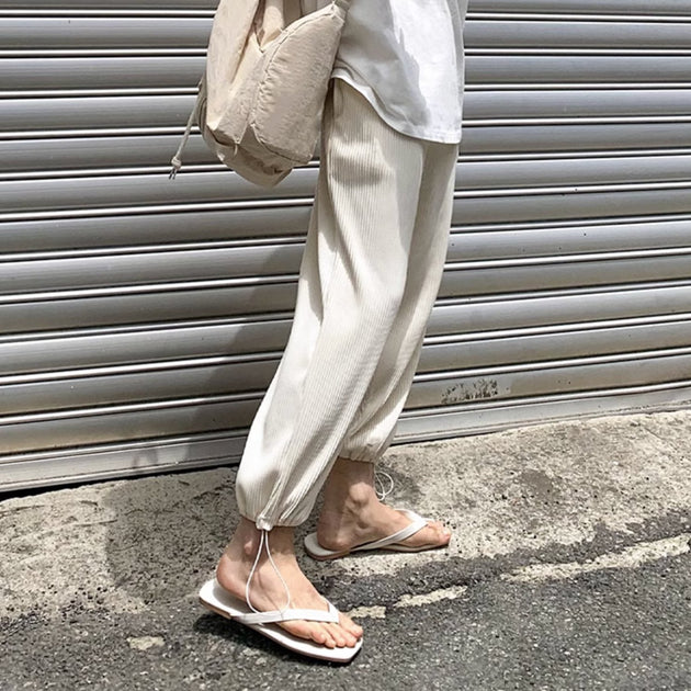 PLEATED ANKLE PANTS - Aumori