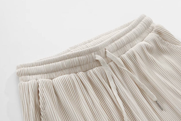 PLEATED ANKLE PANTS - Aumori