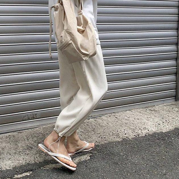 PLEATED ANKLE PANTS - Aumori