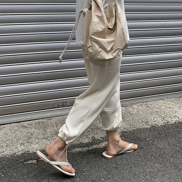 PLEATED ANKLE PANTS - Aumori