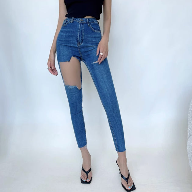 RIPPED TIGHT JEANS - Aumori